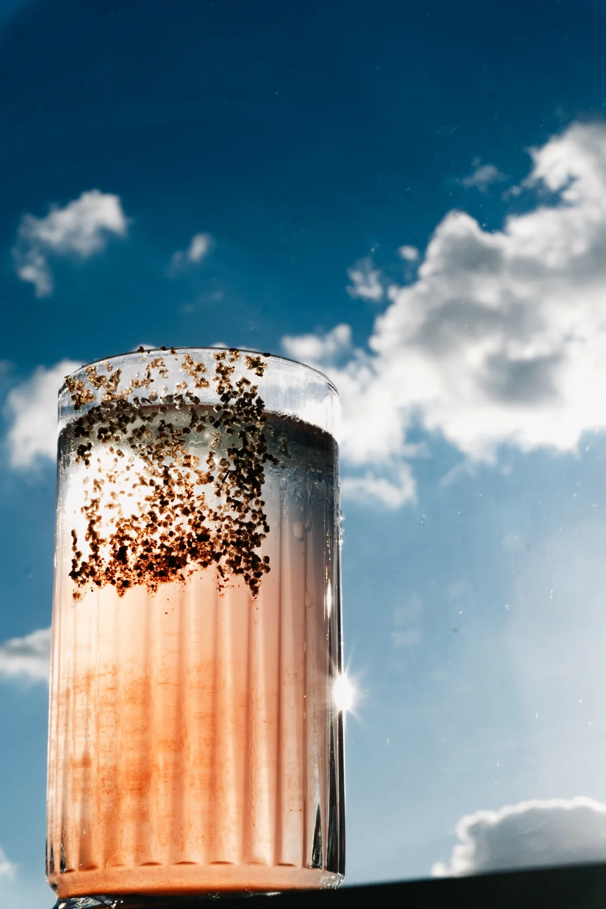 Light passing through a tall cocktail glass